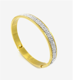 Gold bangle with stone setting